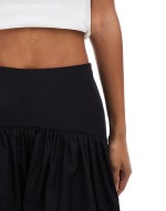 dropped waist mini skirt in black